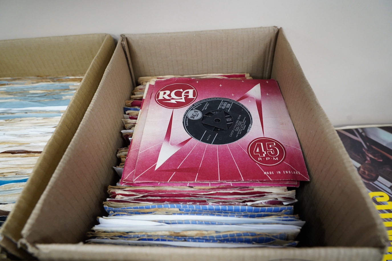 Three boxes of 7” singles on London, RCA, United Artists, Warner Brothers, Regal, Reprise, etc. labels, artists including; Jack Scott, Elvis Presley, Neil Sedaka, The Everly Brothers, Joe Cocker, Rolling Stones, etc. Con